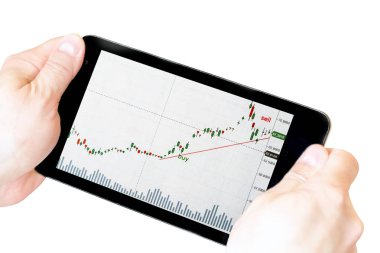 elinde stok grafikleri ile tablet. elinde tablet whi izole