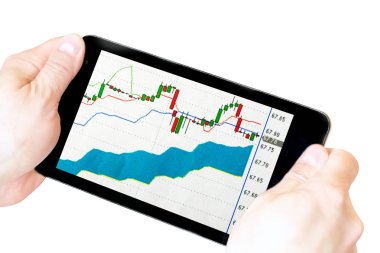 elinde stok grafikleri ile tablet. elinde tablet whi izole