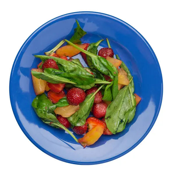 Salad with strawberries, pineapple and spinach on a plate. frui — Stock Photo, Image