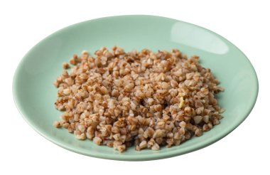 Beyaz arka planda izole bir plaka karabuğday. Karabuğday üst