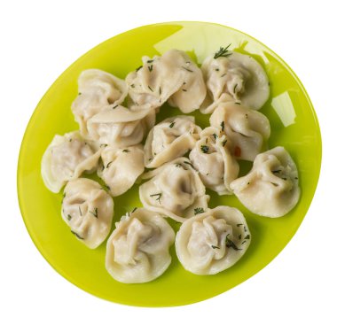 Beyaz arka planda izole bir plaka üzerinde köfte. et Dumpling