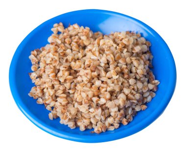 Beyaz arka planda izole bir plaka karabuğday. Karabuğday üst