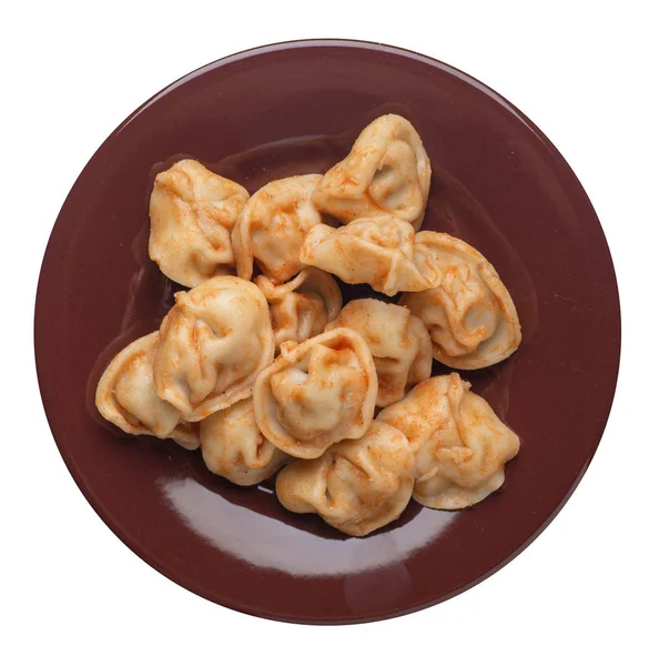 Dumplings on a plate isolated on white background. dumplings in tomato sauce top view — Stock Photo, Image