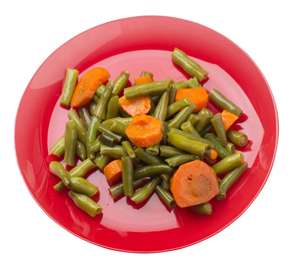 Green beans with garlicand carrots  on a plate isolated on white — Stock Photo, Image