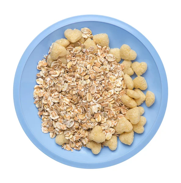 Gesundes Frühstück auf einem Teller isoliert auf weißem Hintergrund. Müsli mit Cornflakes, Rosinen, Datteln, Birnen und Ananas getrockneten Cashewnüssen. — Stockfoto