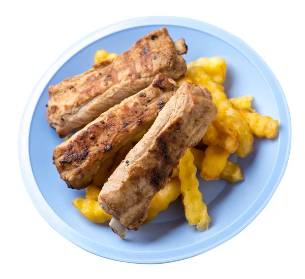 grilled pork ribs with french fries on a plate. pork ribs with french fries on white background. ribs with potatoes top view