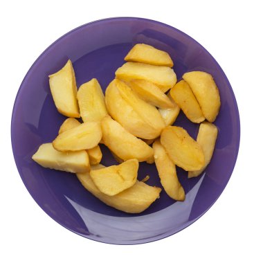 bir plaka üzerinde kızarmış patates takozlar. kızarmış patates sebzeler üzerinde izole