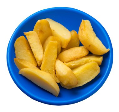 bir plaka üzerinde kızarmış patates takozlar. kızarmış patates sebzeler üzerinde izole