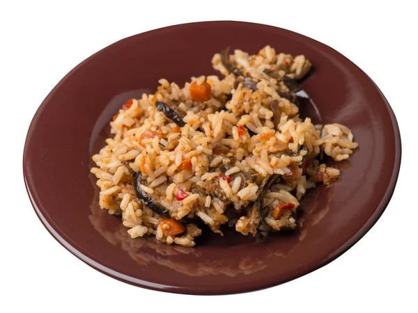Nasi dengan zucchini direbus dengan tomat dan paprika di atas piring . — Stok Foto
