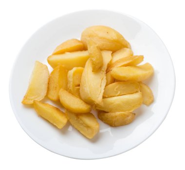 bir plaka üzerinde kızarmış patates takozlar. kızarmış patates sebzeler üzerinde izole