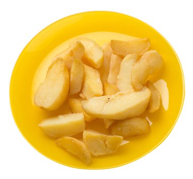 bir plaka üzerinde kızarmış patates takozlar. kızarmış patates sebzeler üzerinde izole