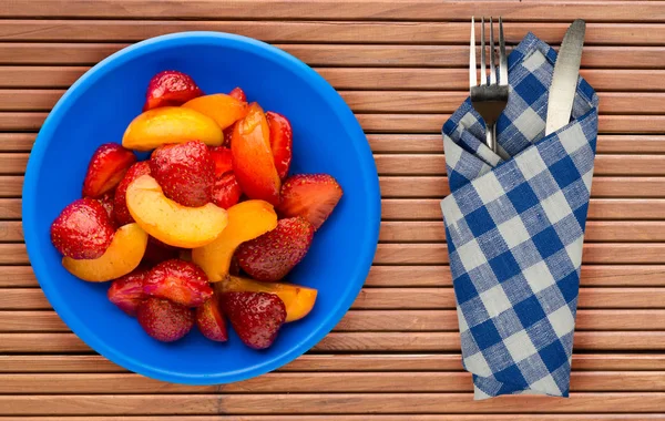 Fruits on a blue  plate on a orange  wooden background .fruits o — Stock Photo, Image