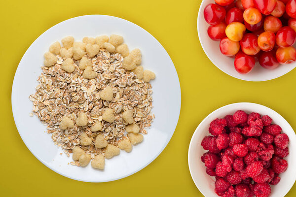 granola on a white plate on background.muesli with fruit on a pl