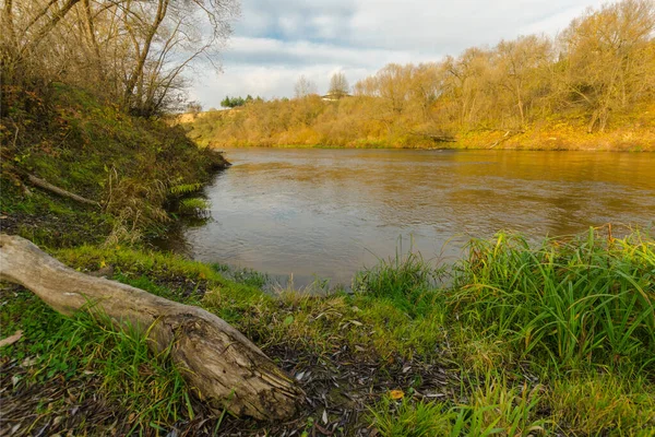 autumn landscape. river at sunset in the autumn forest. river going into the distance