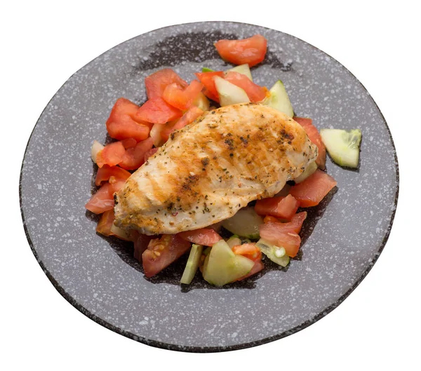 grilled chicken breast salad with tomato, cucumber and onion .grilled chicken breast on a plate isolated on white background. grilled chicken breast top side view