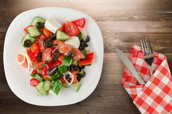 Greek Salad Brown Wooden Background Greek Salad White Plate Fork — Stock Photo, Image