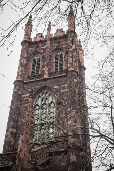 Old religious tower in the streets of Manhattan