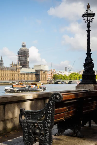 Big Ben in work from the Thames river quays