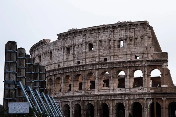 Ancient columns of the Sacred Way next to the Colosseum in Rome, Italy