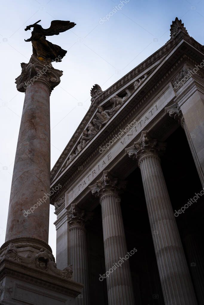 Angels on the columns of the Vittorio Emanuele II monument in Rome, Italy