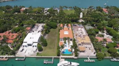 Waterfront residential area on Star island, Miami. Florida landscape view. Star Island in Miami beach, Florida. Residential buildings in luxury Star island surrounded by sea. Ocean views.