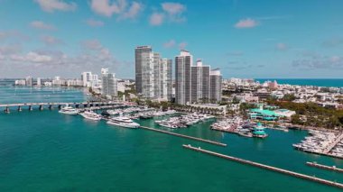 Marina with sailboats. Luxury life. Miami luxury marina. Summer vacation. Marina aerial view. Yacht sea harbor. Luxury south beach marina. Miami skyscraper at south beach. Docked luxurious yacht boat.