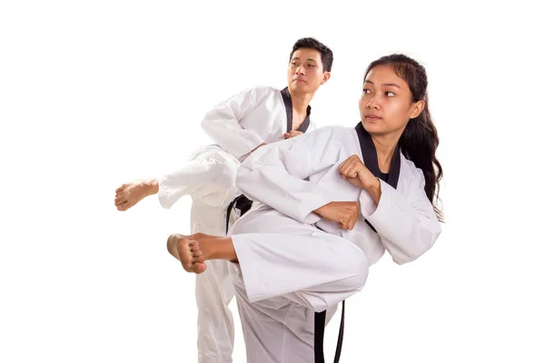 Manliga Och Kvinnliga Taekwondo Idrottare Göra Sparkar Ställningstaganden Synk Inomhus — Stockfoto
