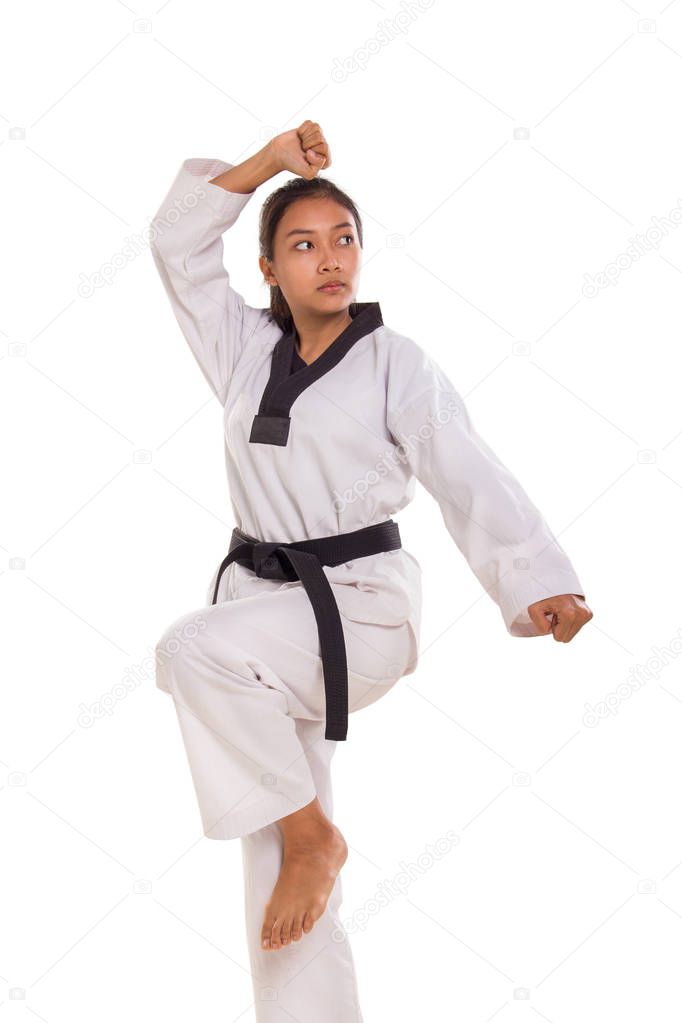 An Asian female tae kwon do athlete posing, isolated on white background