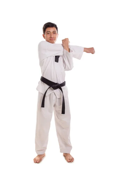 Male martial artist arm muscle stretch, isolated full length — Stock Photo, Image