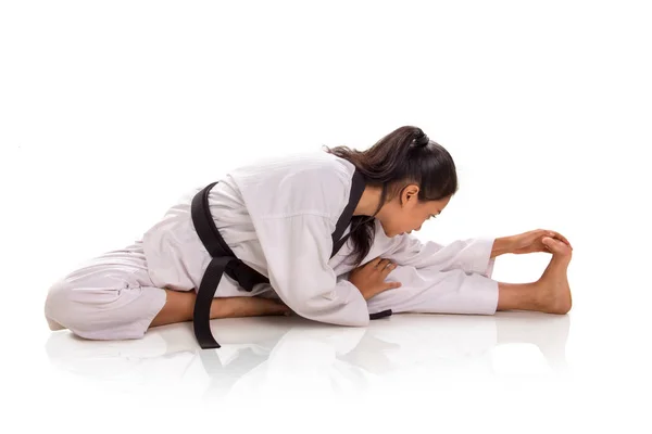 Flex to touch her toe, muscle warm-up Stock Image