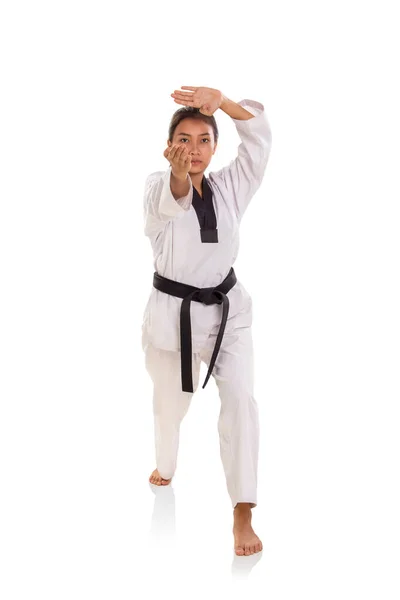 Female taekwondo athlete with thrusting hand strike stance — Stock Photo, Image