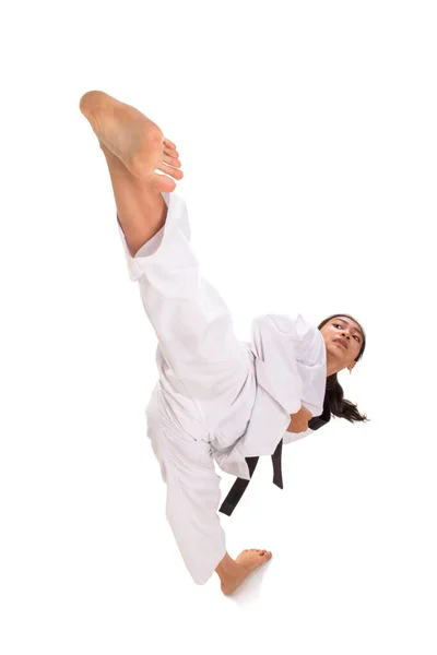 Young female taekwondo master high kick skill ストック画像