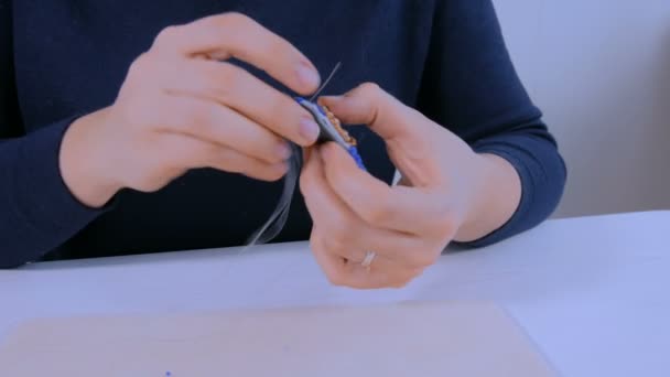 Designer making handmade brooch — Stock Video