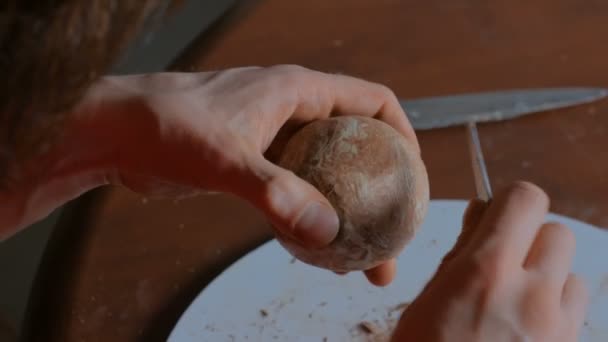 Professional potter shaping dry clay cup with special tool in pottery workshop — Stock Video