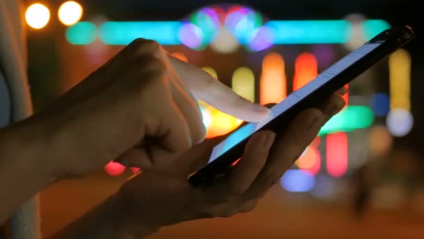 Woman using smartphone in the city — Stock Video