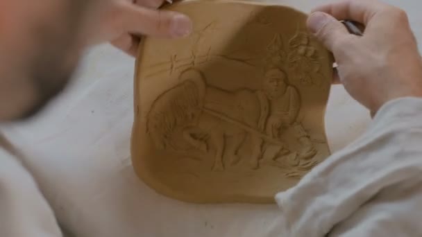 Potter making clay stamp picture — Stock Video