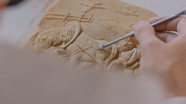 Potter making clay stamp picture — Stock Video