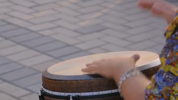 Man playing ethnic drum on street — Stock Video