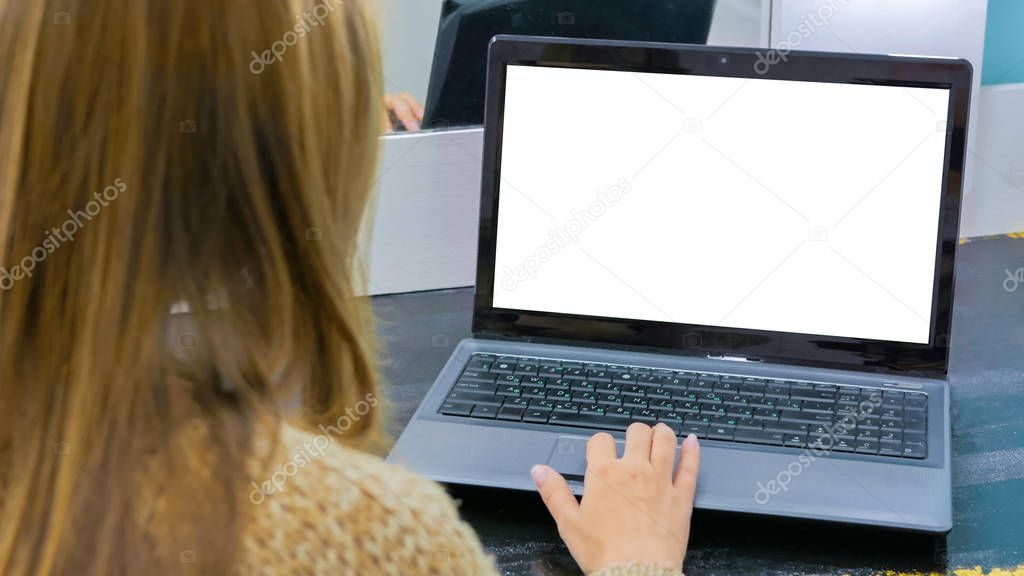 Mock up concept - woman using laptop with white empty display