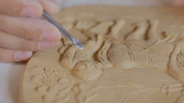 Potter making clay stamp picture — Stock Video