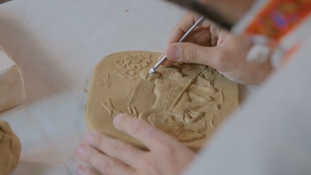 Potter making clay stamp picture — Stock Video