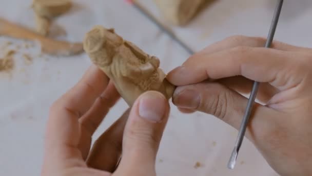 Potter making clay figure for board game — Stock Video