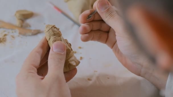 Potter making clay figure for board game — Stock Video