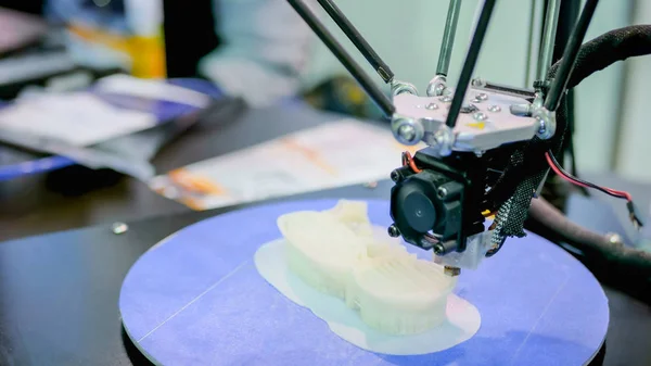 Modern 3D printer machine printing plastic model