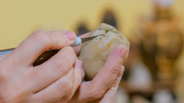 Woman potter making ceramic souvenir penny whistle in pottery workshop — Stock Photo, Image