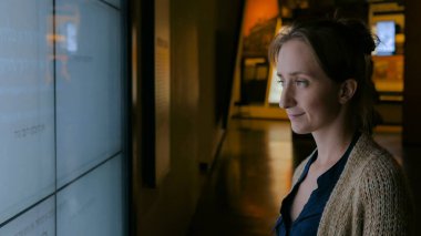 Woman looking at interactive touchscreen display