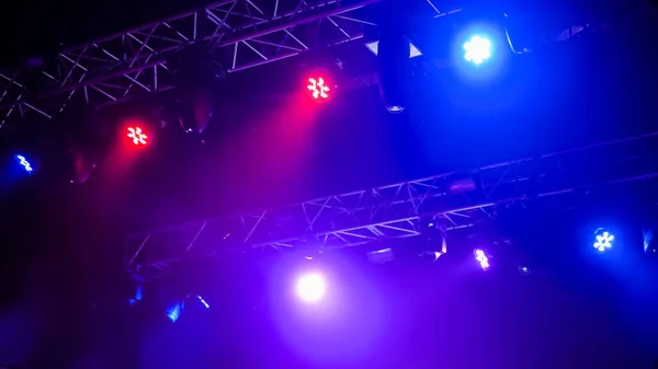 Colorful bright concert lighting equipment for stage at nightclub