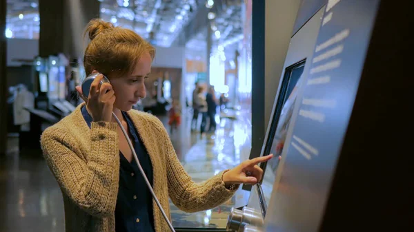 Woman using interactive touchscreen display