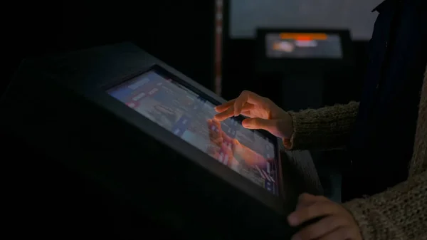 Woman using interactive touchscreen display