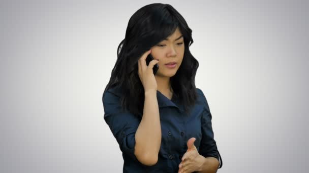 Businesswoman in blue suit talking on the cell phone on white background — Stock Video